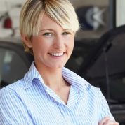 woman smiling to the camera in the workshop
